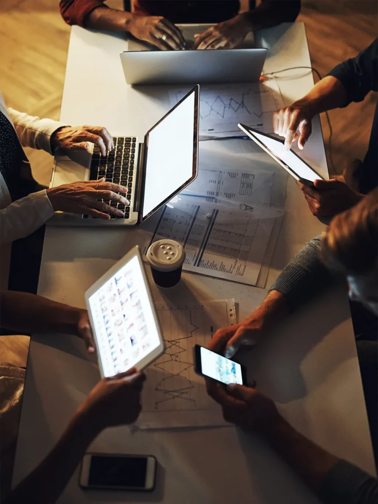 A Team Working Together on Different Devices